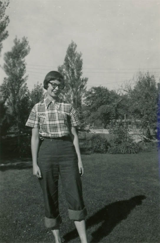 Vintage Snapshot photo 1950 Cute Young Woman Cat Eye Glasses Rolled Blue Jeans Mid Centruy