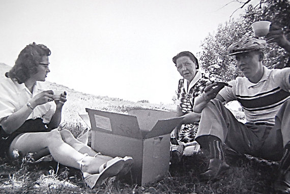 1940s vintage of family having a box lunch picnic