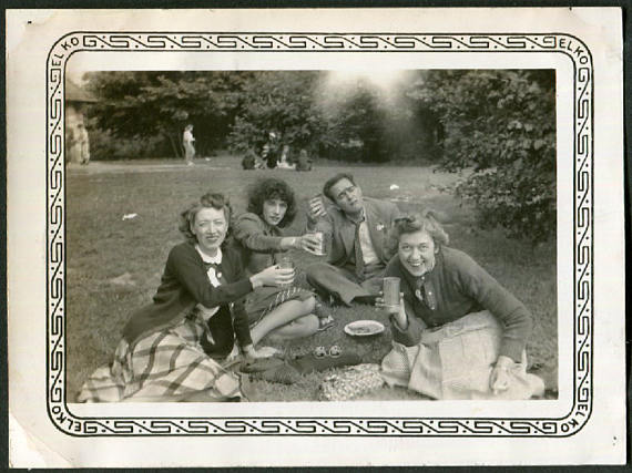 1940s Vintage Photo of Friends Lifting Their Glasses on a Picnic. Super 1940s Fashions and 1940s hairstyles. 