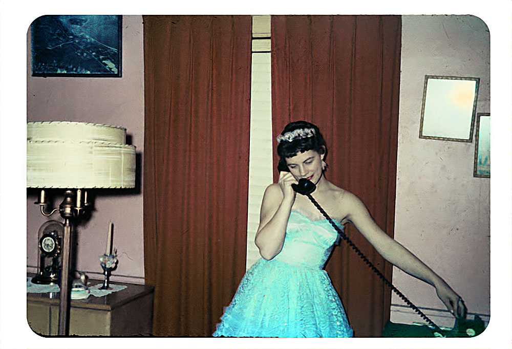 Before the dance, 1958 girl in a fancy 1950s gown in her livingroom vintage image