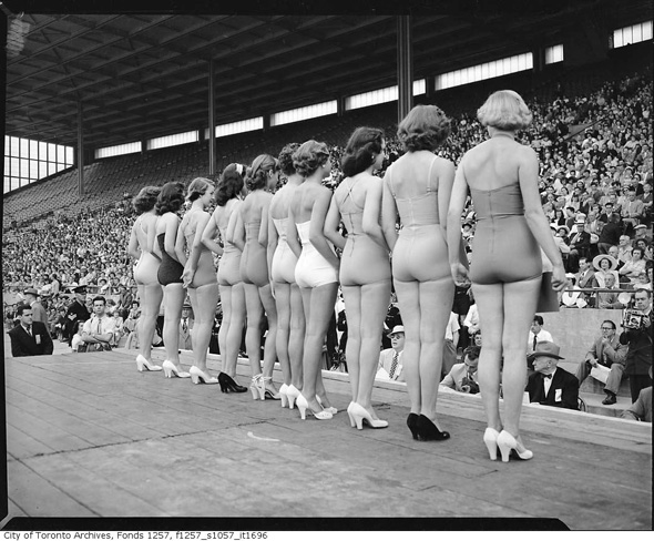 1950s vintage image of women in 1950s bathing suits posing for the Miss Toronto Pageant. 