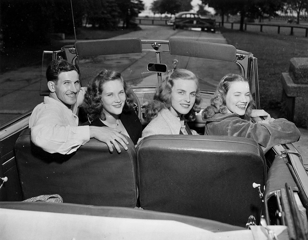 1940s photo of 3 young women and 1 man posing in a car for the "Safety Quiz' of 1948. Fantastic 1940s hairstyles on our lovely ladies. 