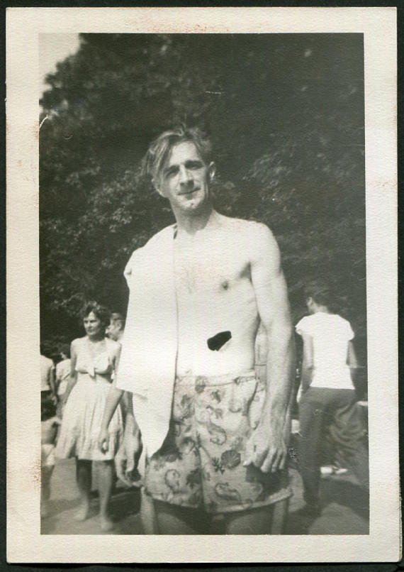 1940s vintage photo of a man in a 1940s swimsuit posing in the summer time. 