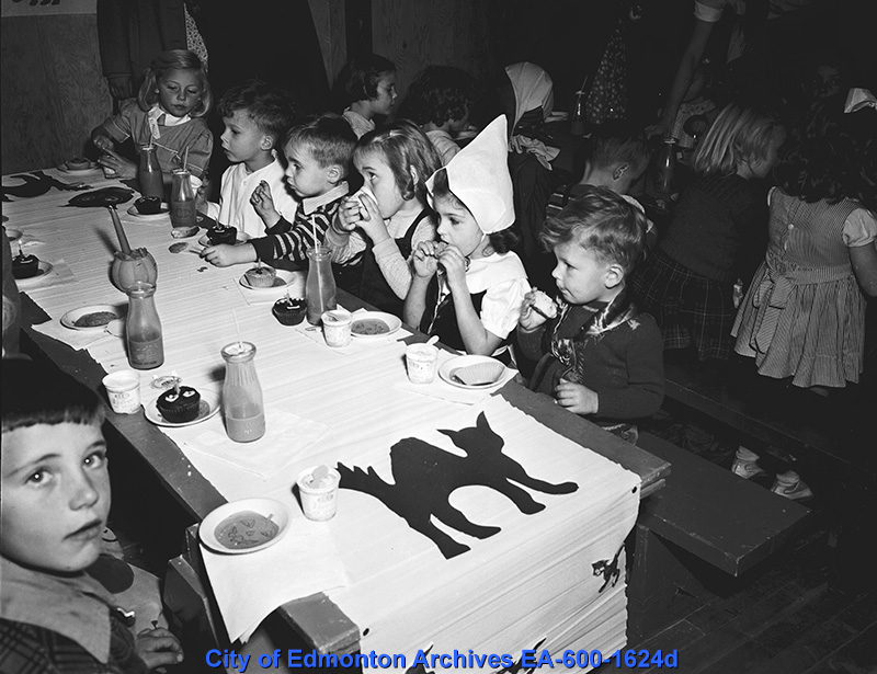 1940s vintage photo of a Kids Halloween party. Children at a Halloween party at Highlands Community Hall in 1948 (Edmonton, Canada).