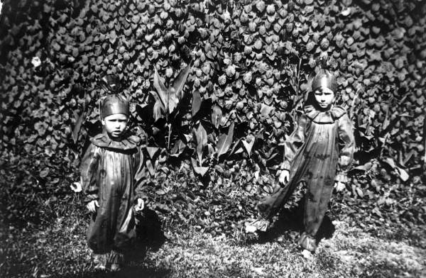 1930s vintage photo of two kids dressed in royalty costumes for Halloween in Florida. 