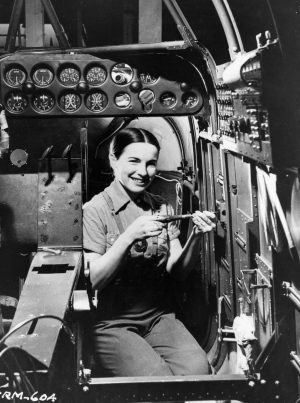 1940s Vintage Photo of a Young woman working in the cabin of bomber being manufactured at the Fairchild plant in Montreal on May 19, 1941.