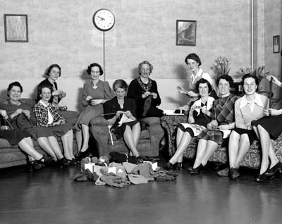 1940s Vintage Photo in 1942 of knitters working on the BC Telephone Co. War Effort Programme in Victoria. It was a group of ladies coming together to sit, talk, and knit scarves and socks for the Canadian men fighting overseas