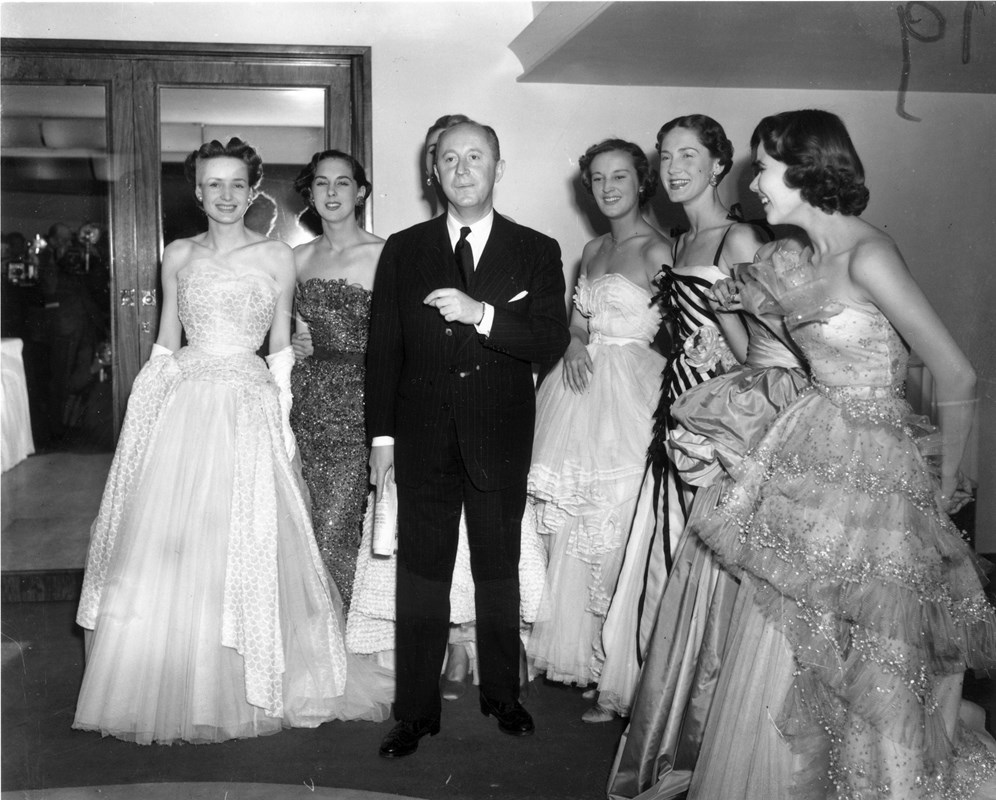 1950s vintage photo / 1950s fashions: Christian Dior with models in his 1950s evening gowns.