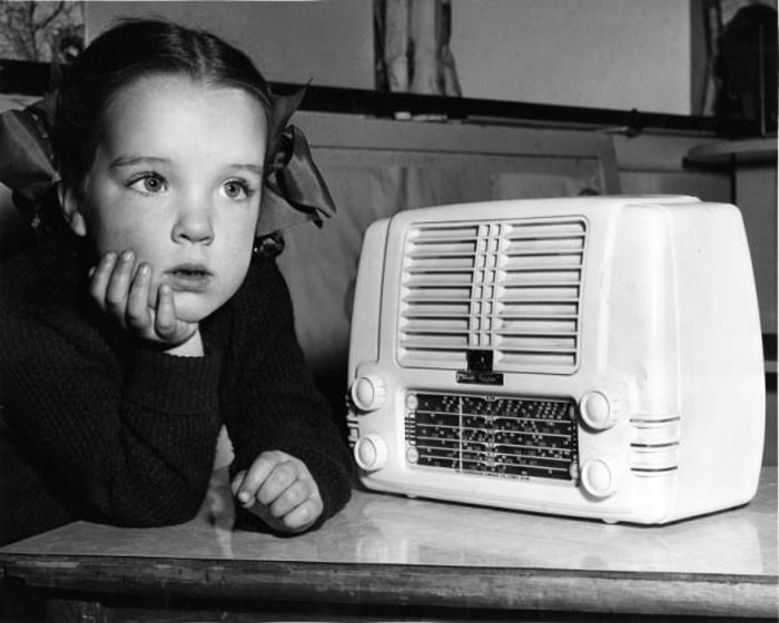 Vintage Radio, child listening to it