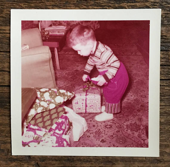 1957 vintage image of a little boy with presents