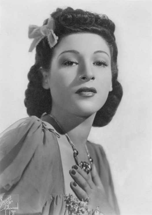 1940s Vintage Image of Big Band Singer, Bea Wain in 1943 in a beautiful 1940s Hairstyle with Hair bow. 