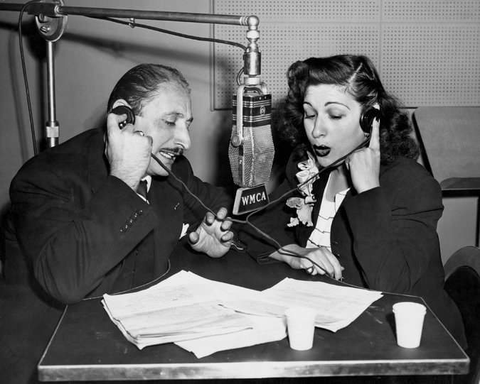 1940s Vintage Photo of Bea Wain, big band singer with her husband, Andre Baruch, at WMCA in 1947.