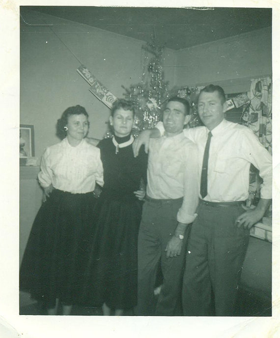 Christmas 1957 Group Family Photo Standing in Front of the Christmas tree in 1950s fashions. 