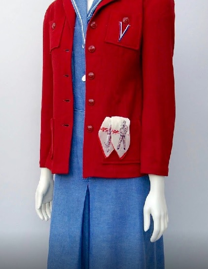 Black cotton skirt and red and blue striped cardigan sweater (1944 - 1946)