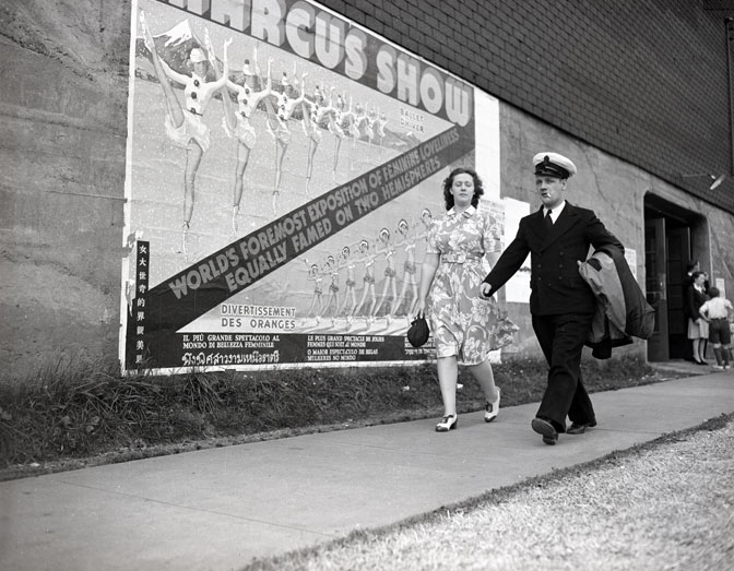 1940s vintage photo of a serviceman and his date in a 1940s dress going to the Marcus Dance show in Halifax, Nova Scotia in 1941 during WW2. 