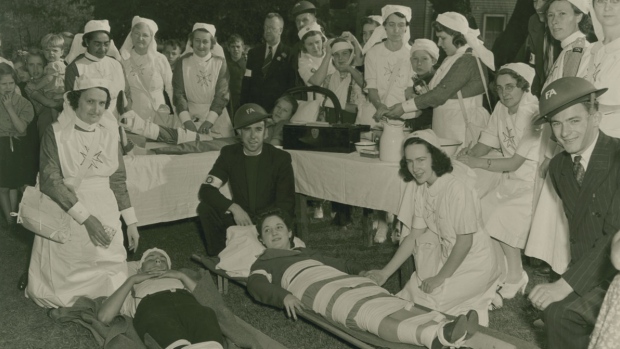 1940s Vintage Photo: Members of the Halifax North (Women’s) Division of the St. John Ambulance Brigade Association in a practice at their headquarters on West Young Street. Halifax Civil Emergency Corps, September 1942