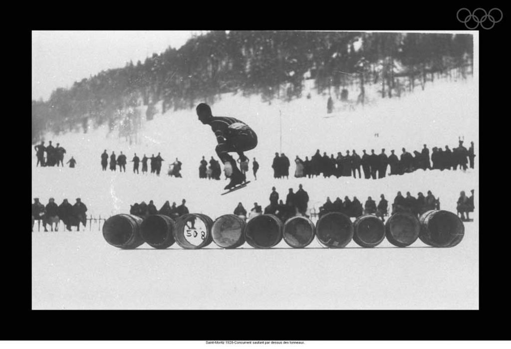 1920s Vintage Photo: Olympic Games at Saint-Moritz 1928-Competitor jumping over barrels.