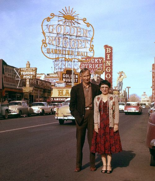 1950s Vintage Photo of an older couple in 1950s fashions posing in front of the Golden Nugget sign. 