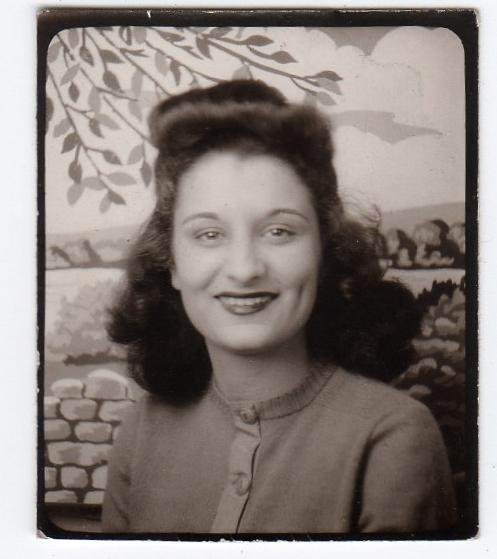 1940s photobooth vintage image of a beautiful young woman with a fantastic 1940s hairstyle