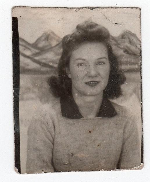 1940s young woman vintage photo taken in a photobooth. Great 1940s hairstyle.