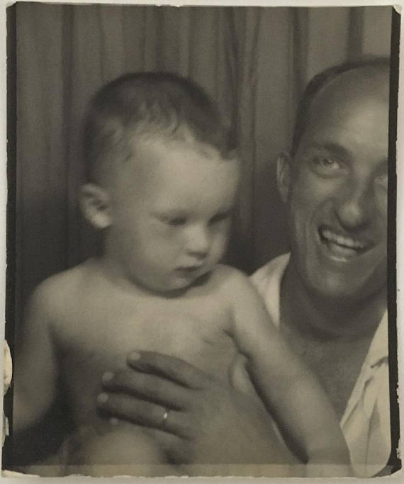 Vintage Photobooth image of a baby and father 