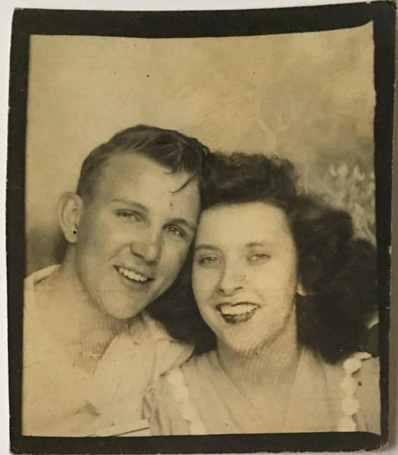 1940s vintage photobooth image of young couple in love