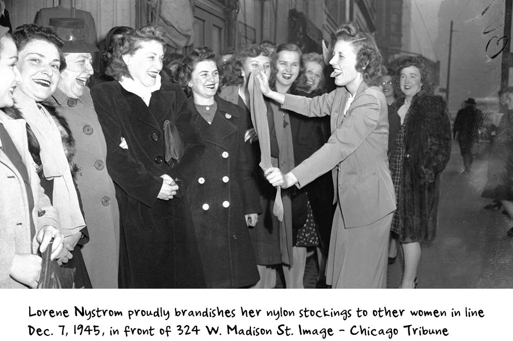 1940s Vintage Photo of a woman holding her nylon stockings to other women in line December 7th, 1945 in Chicago. Super 1940s fashions. 