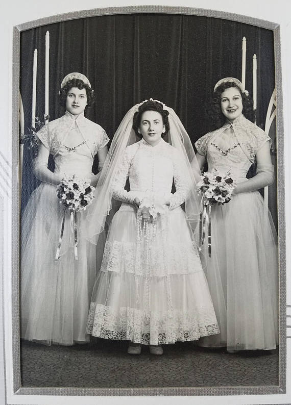 Photo of late 1940s / Early 1950s Bride with Two Bridesmaids. The Vintage Wedding Photo features  a stunning 1950s Wedding dress & 1950s Bridesmaid dresses.