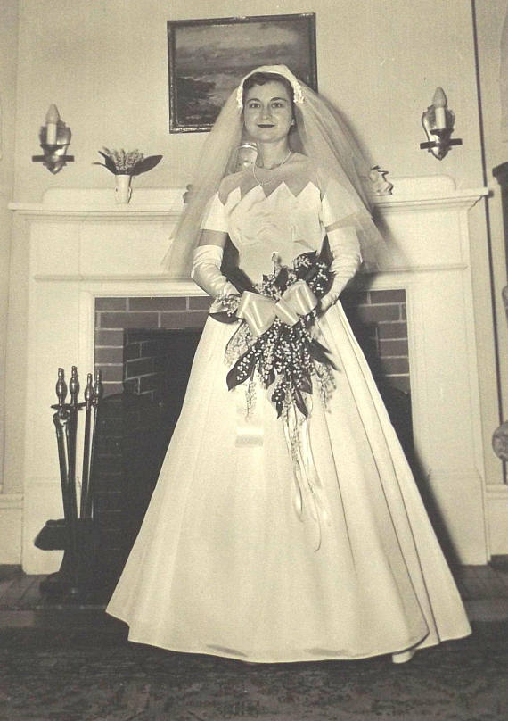 1950s Vintage Wedding Photo: Vintage photo of a 1950s bride in her wedding dress with scalloped neckline