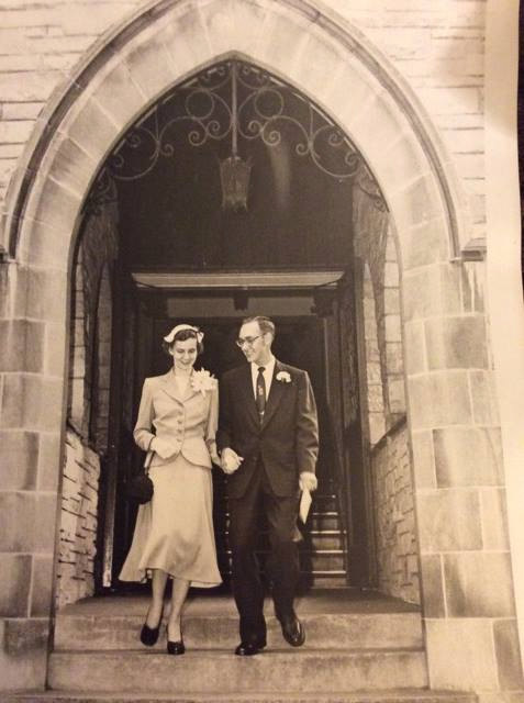 vintage 1950s wedding photo of a young couple coming out of the church