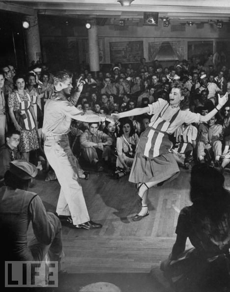 1940s vintage photo of Dorothy McGuire doing the Lindy at the Stage Door Canteen