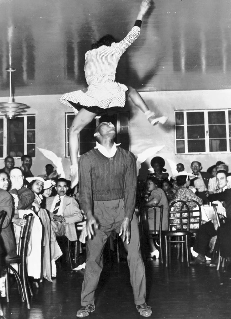 1940s vintage photo of Frankie Manning & Ann Johnson in 1941, demonstrating an Aerial Step that Frankie was the original creator of.