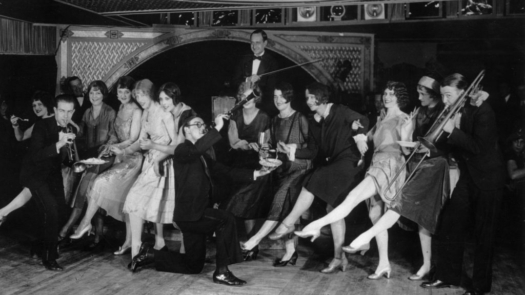 1920s photo of flappers and musicians having a party