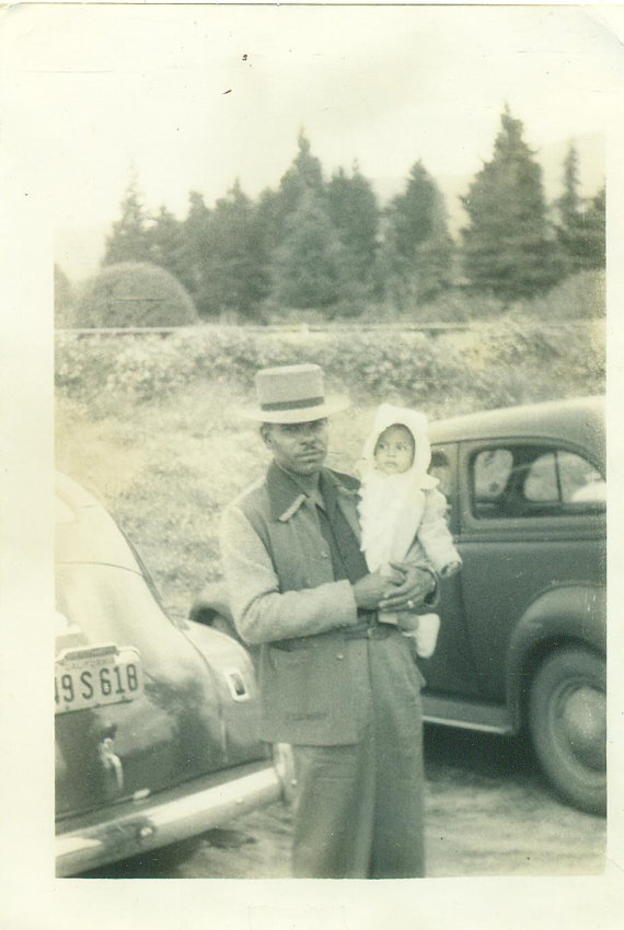 1940s vintage photo of a Black man with his baby