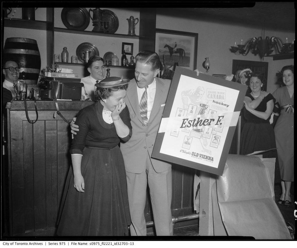 1950's Vintage Photo of an advertising launch at Toronto O'Keefe's Pub. Image features super 1950s fashions. 