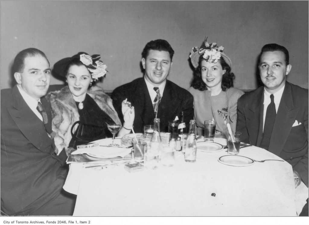 1950s vintage photo of Russell Spanner (centre) and friends at the Club Norman. Fantastic 1950s hats on our ladies at the table. 