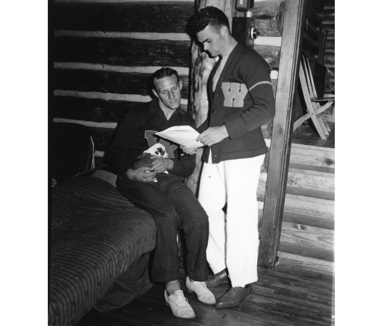 Vintage of 2 men in Lettermen sweaters from Wayne State University hanging out in the 1940s. -1940s vintage student life photo. 