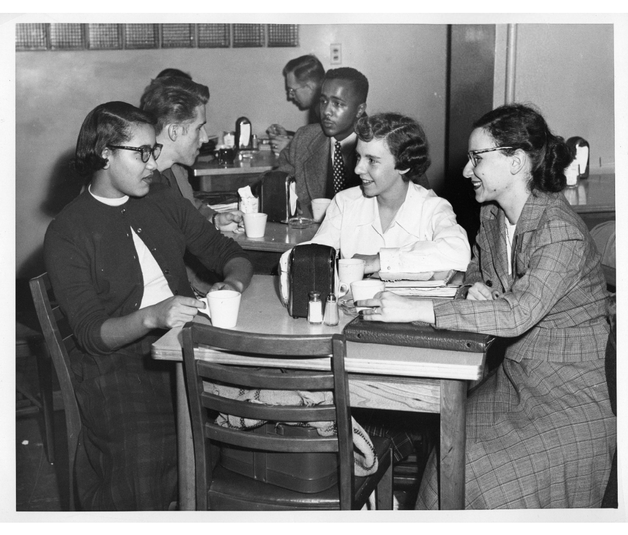 Friends hanging out at school cafeteria in the 1950s at Wayne State University. Vintage Photo