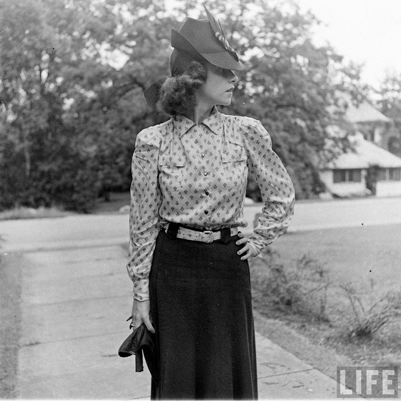 1930s vintage photo of 1938 Women's fashion. Stunning 1930s hat, 1930s skirt and 1930s blouse plus 1930s hairstyle for hats. 