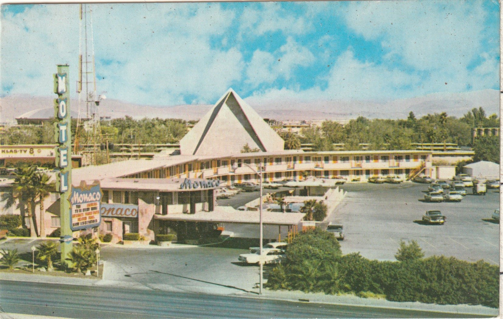 "The Monaco"- 71 room motel with dressing rooms and queen size beds and a heated pool at the corner of Desert Inn Rd & the "Strip". Postcard circa 1950s possibly early 1960s.