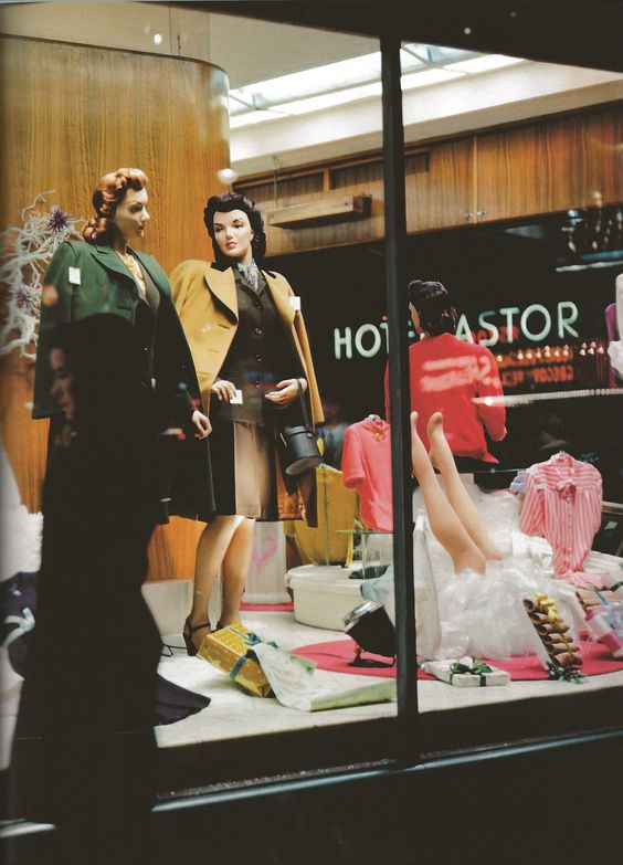 1940s vintage photo of a store window in New York City 1945 showcasing women's jackets. 1940s fashions. 