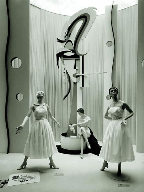 1950s vintage photo of a 1958 Womens Fashion Window Display Vintage Photo featuring women's 1950s evening gowns. 