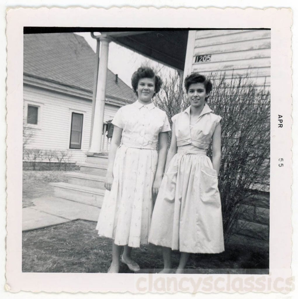 1950s vintage photo: 1958 Mid Century photo of Teenage Girls  with 1950s styled Short Hair in 1950s dresses with pockets. 