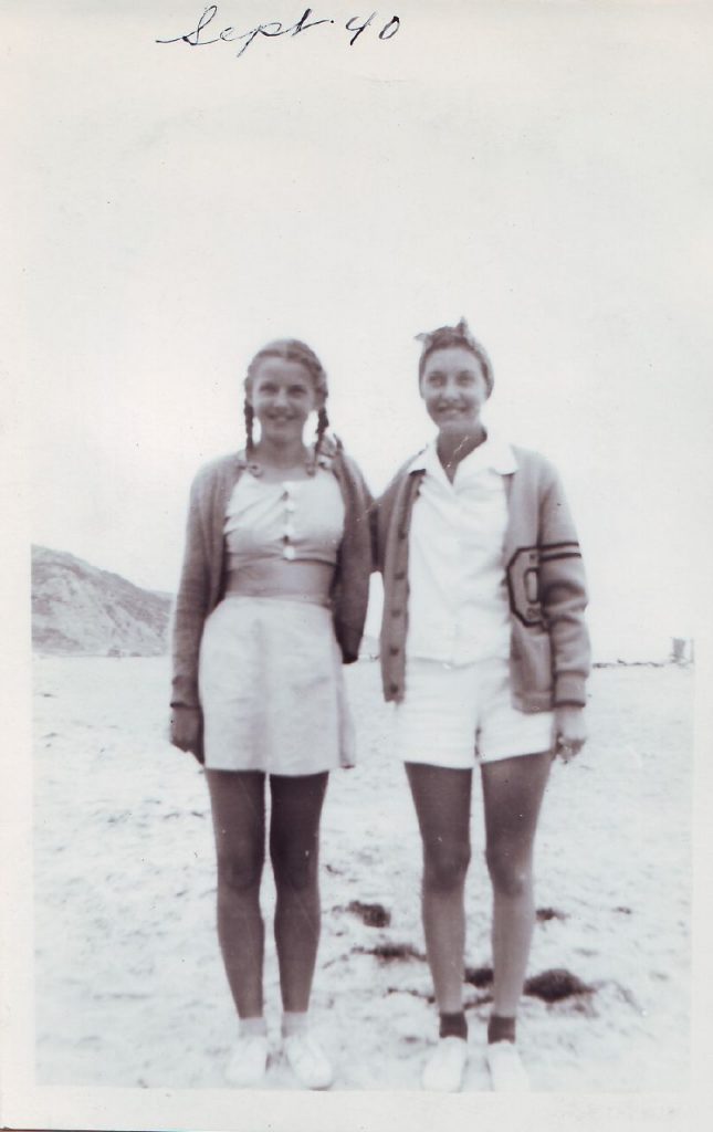 1940s Vintage photo of 2 friends at Virginia Beach. 1940s Summer Fashion and a letterman Jacket. 