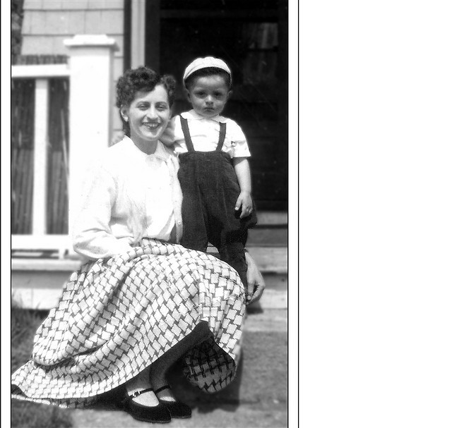 1950s mother in a 1950s skirt with her son on the front step vintage photo mothers day