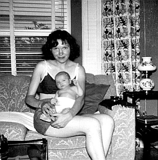 1950s vintage photo of a mother on the couch with her baby happy mothers day