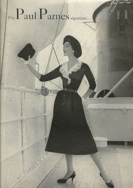  The Paul Parnes Signature Dress 1959 vitnage ad featuring a 1950s dress. The lady is modeling it on a cruise ship.