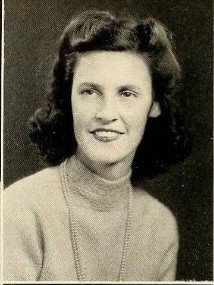 1940s Photo of a young woman in college vintage yearbook book photo from 1941. The woman is wearing a 1940s hairstyle. 