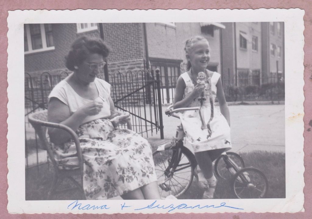 1950s Photo of a young girl and her grandmother on the front lawn 