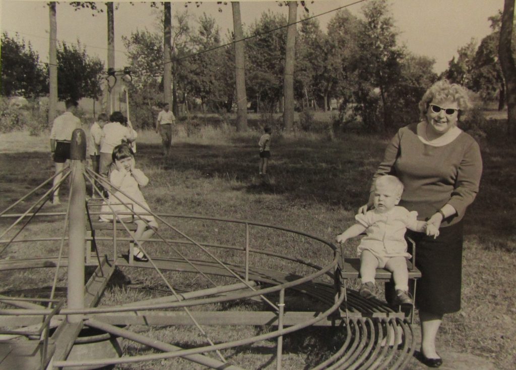 1960s photo of grandmother with her kids at the playground